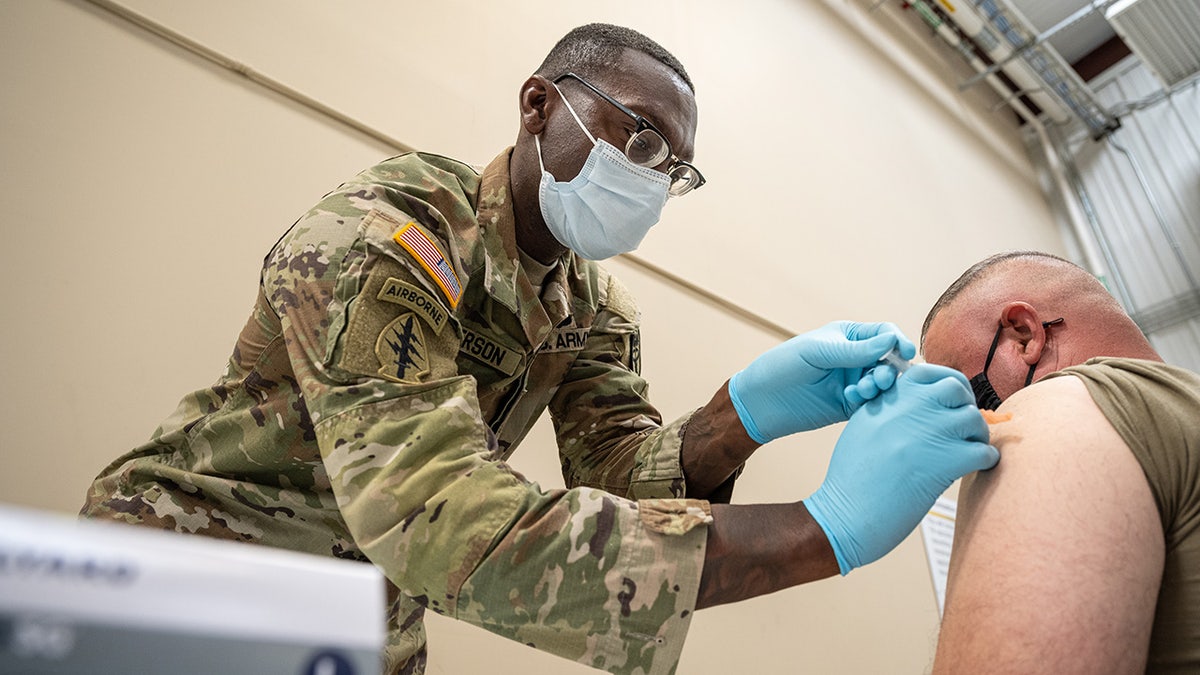 soldier gets covid vaccine