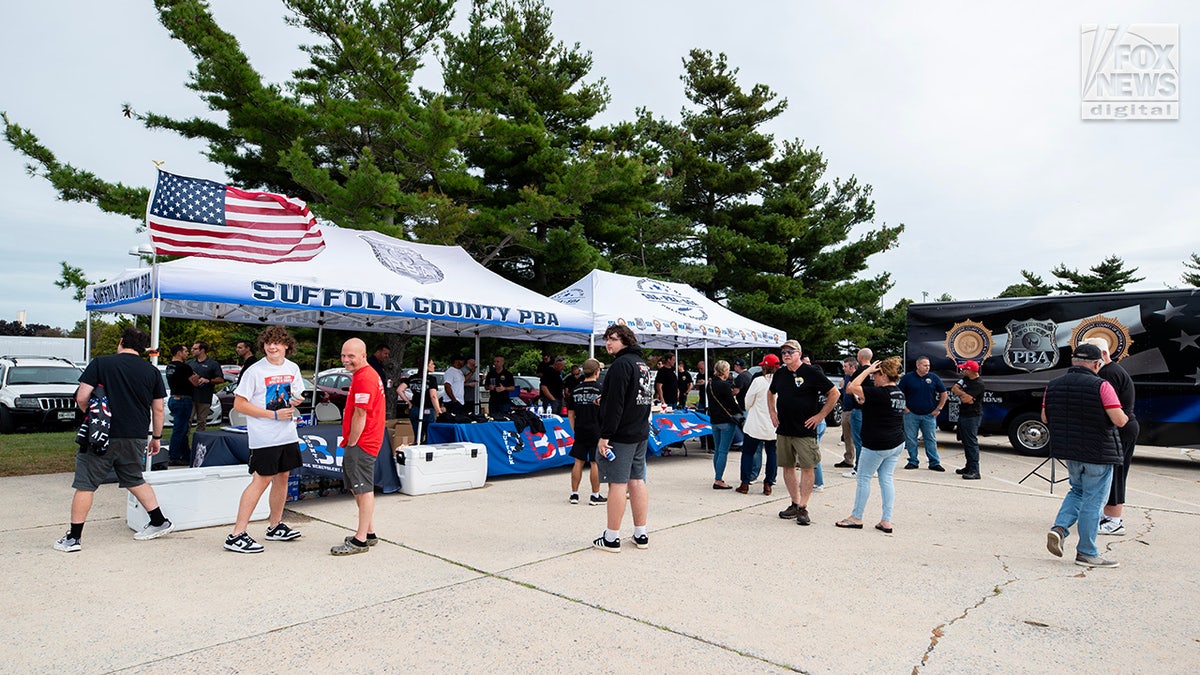 Members of the Suffolk County PBA attend a tailgate ahead of former President Donald Trump’s rally in Uniondale, New York