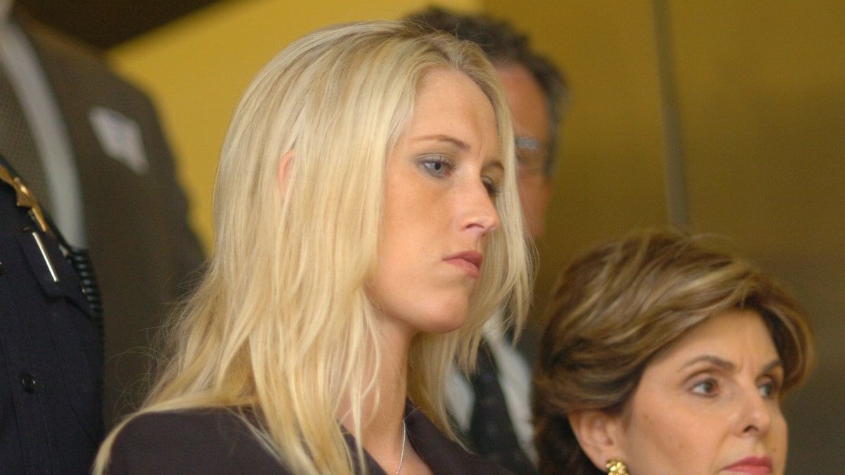 Amber Frey exits the courthouse with her attorney Gloria Allred after a day of testifying during the Scott Peterson double murder trial Tuesday, Aug. 10, 2004, at the San Mateo County Superior Courthouse in Redwood City. 