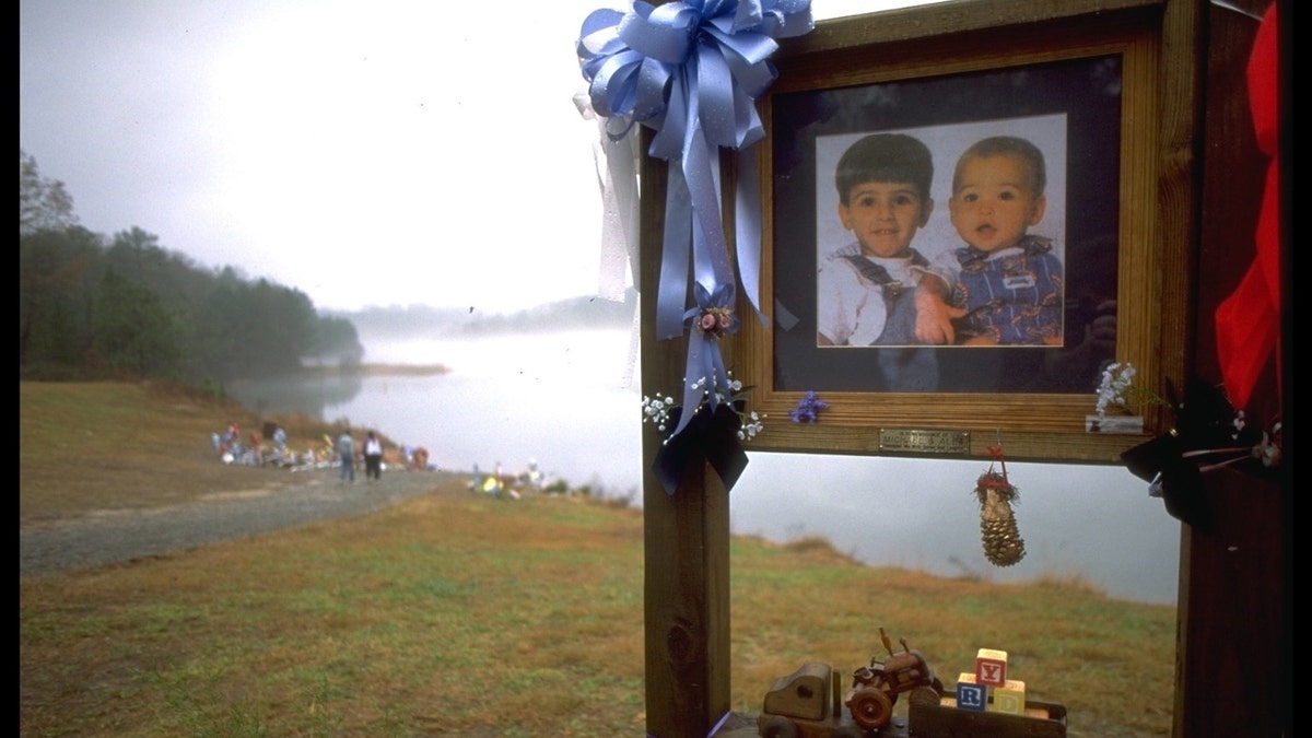 People came from far to place flowers to the lake where the boys were drowned.