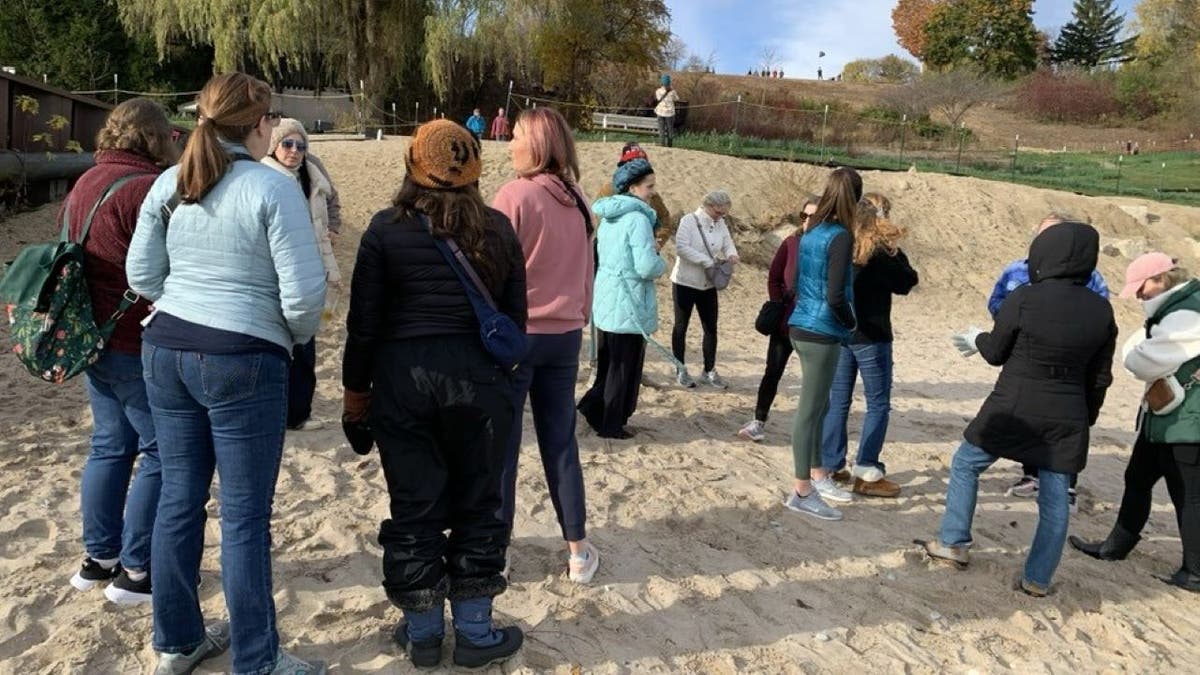 Women standing on sand