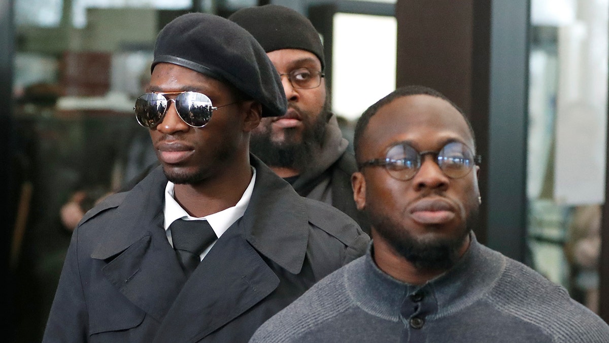 Brothers Olabinjo Osundairo, right, and Abimbola Osundairo, appear outside the Leighton Criminal Courthouse in Chicago