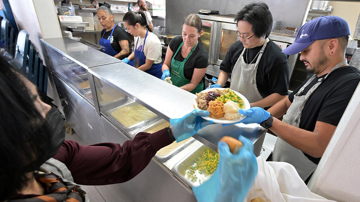 Volunteers serve Thanksgiving meal