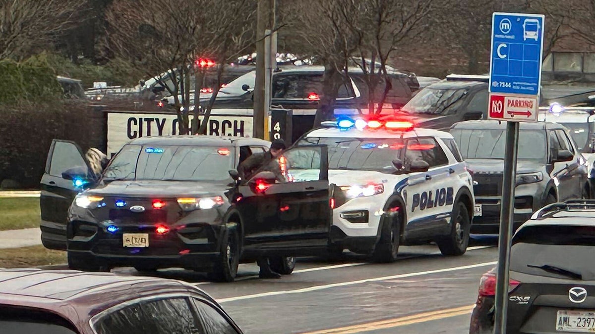 Emergency vehicles are parked outside the Abundant Life Christian School