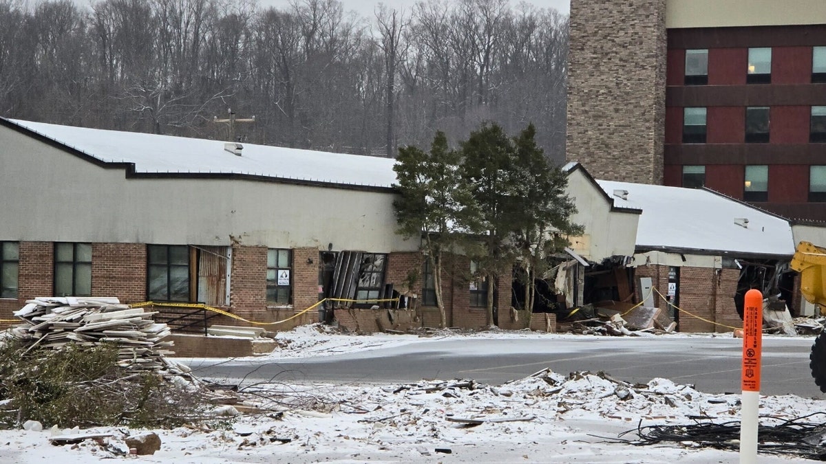 A store in Swannanoa, North Carolina, destroyed by Hurricane Helene is coated in snow on Jan. 10, 2025.