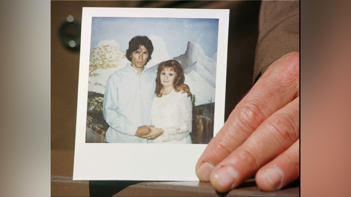 A wedding photograph is displayed to the media of the "Night Stalker" Richard Ramirez and his new bride Doreen Lioy