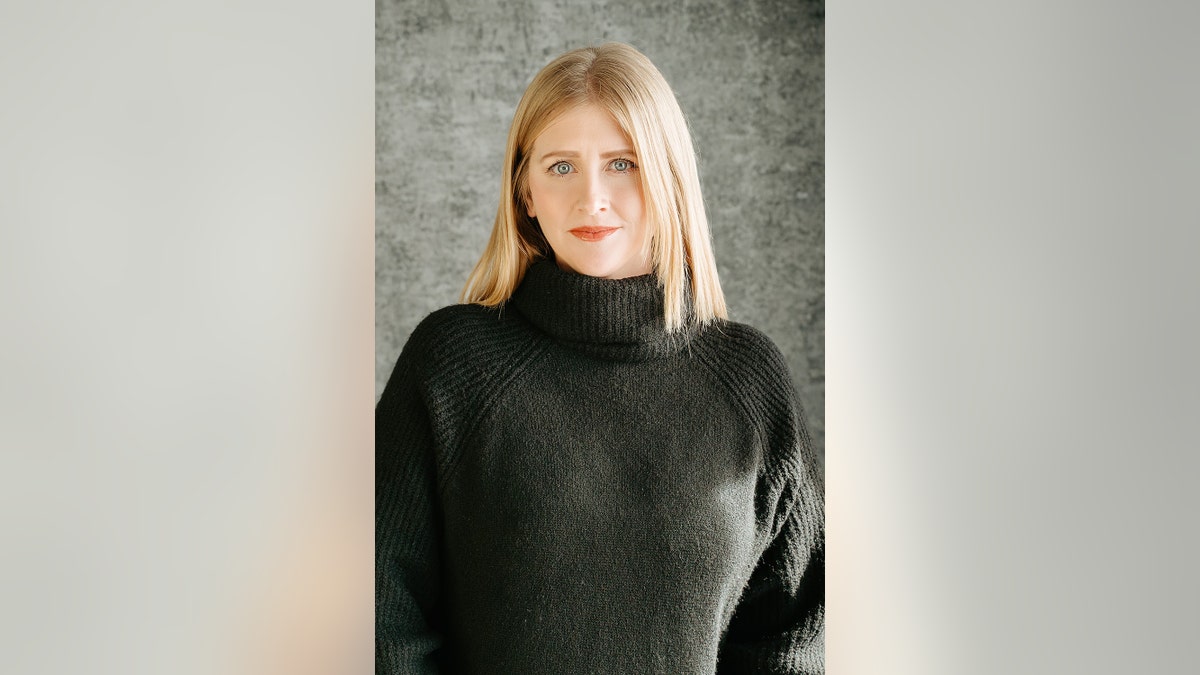 Courtney Lund O'Neill wearing a dark green turtleneck