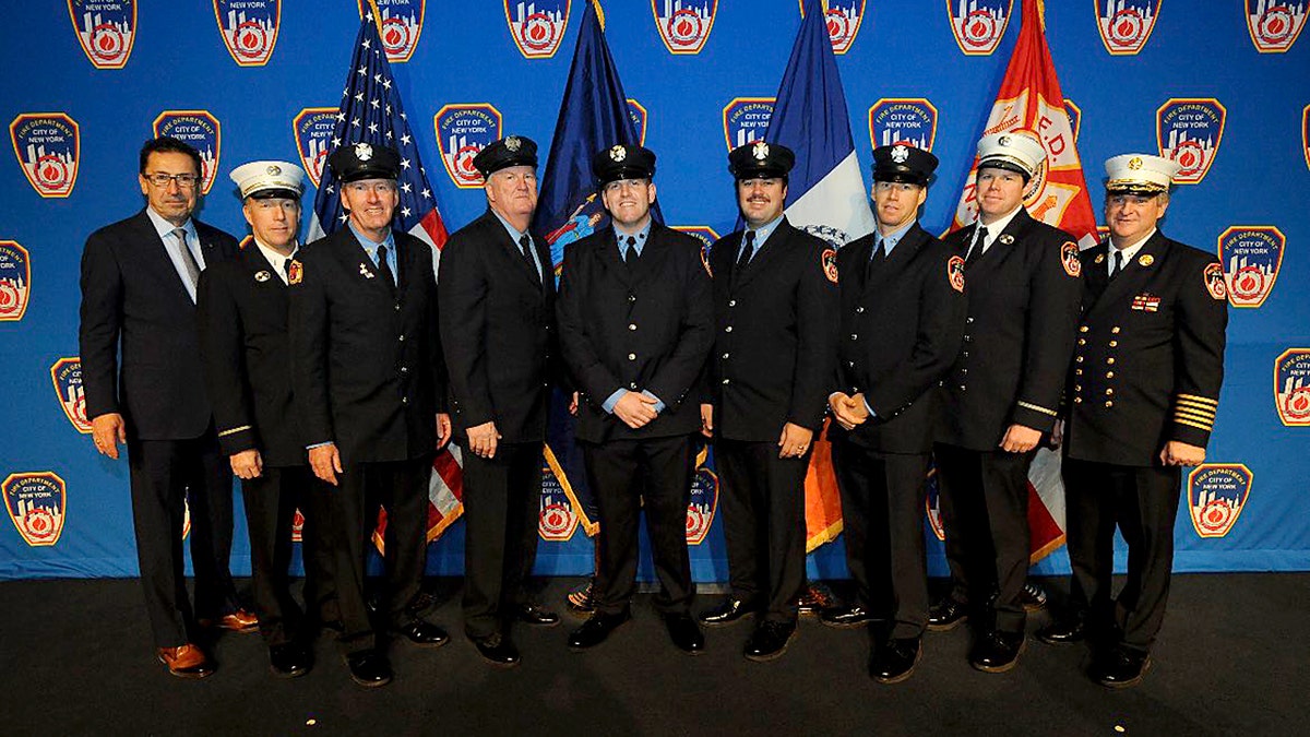 FNDY Patrick Brady, center, in group photo