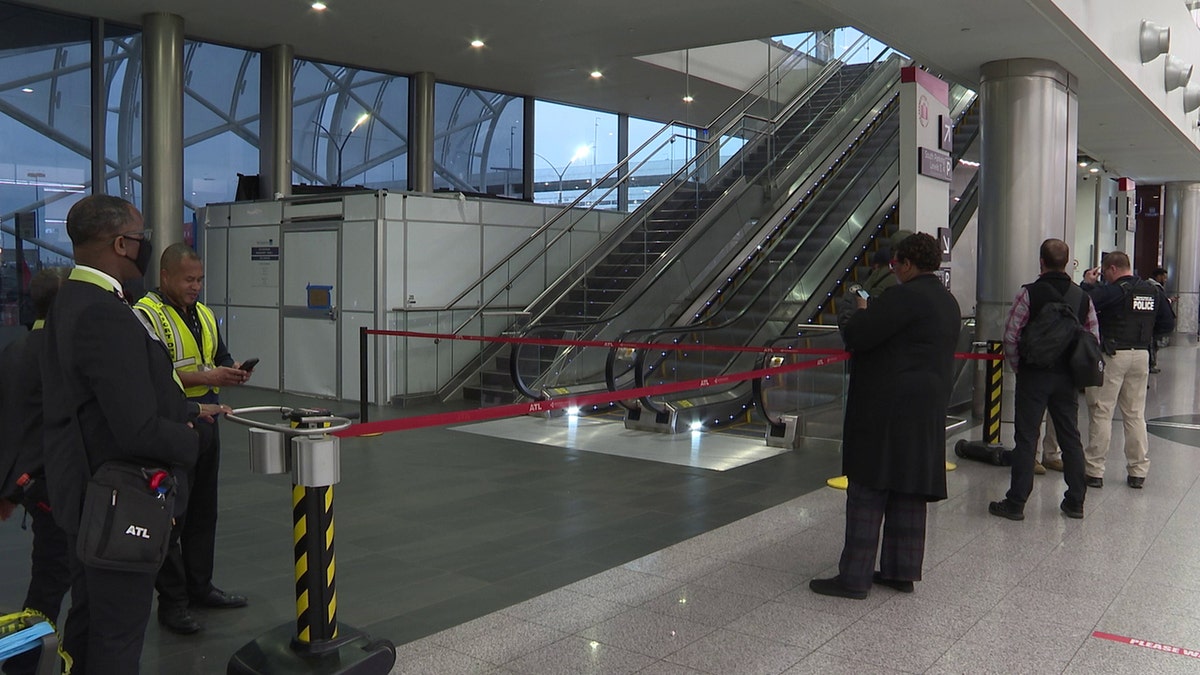 atlanta airport with area secured off in baggage area