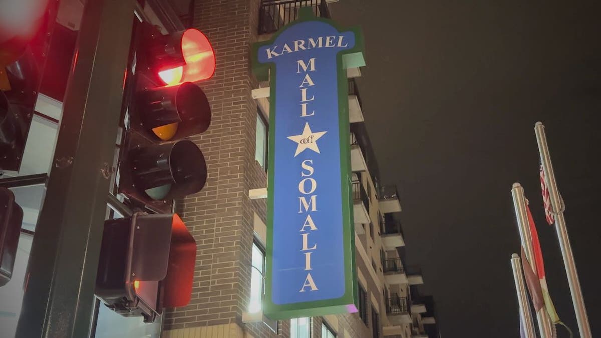 Karmel Mall sign illuminated at night in Minneapolis