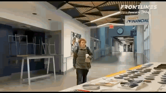 gif student swipes TPUSA table steals signs