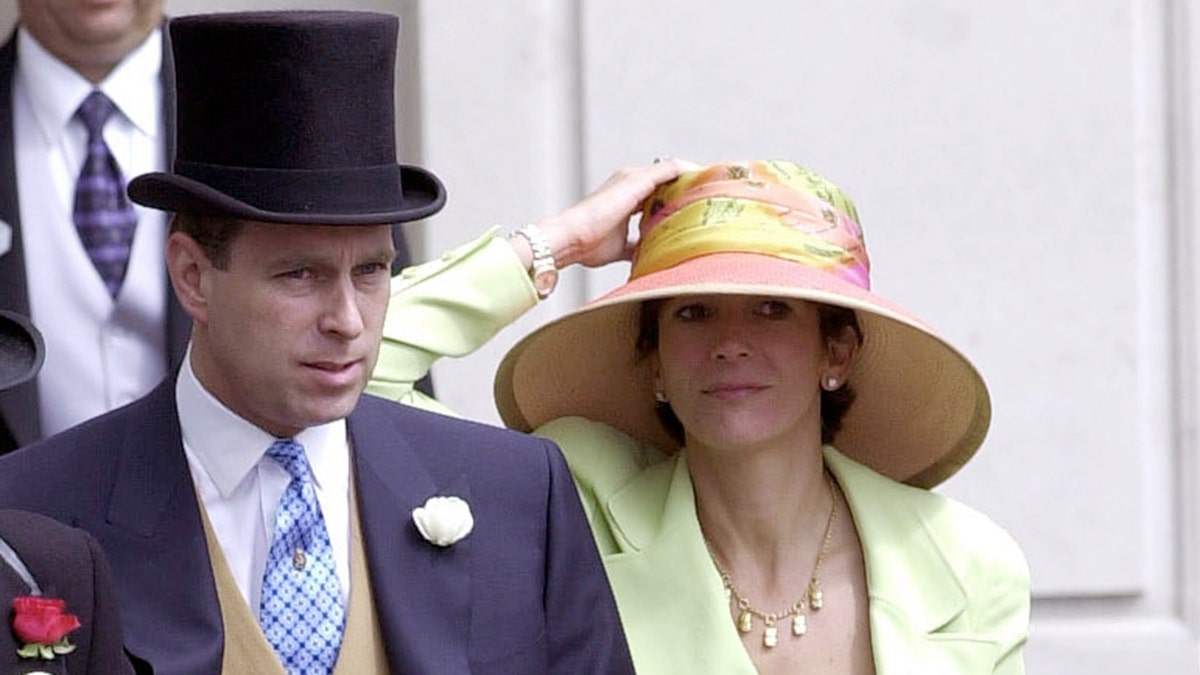 A close-up of Prince Andrew in formal wear walking next to Ghislaine Maxwell.