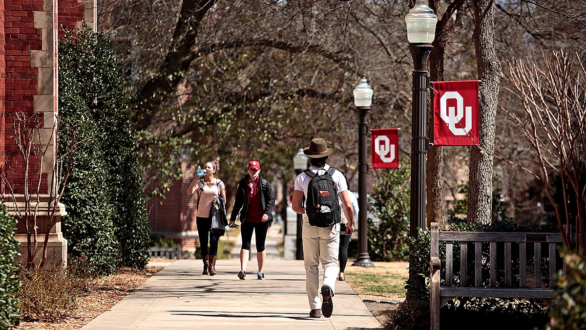 Students walk across the University of Oklahoma campus between classes in Norman, Oklahoma.