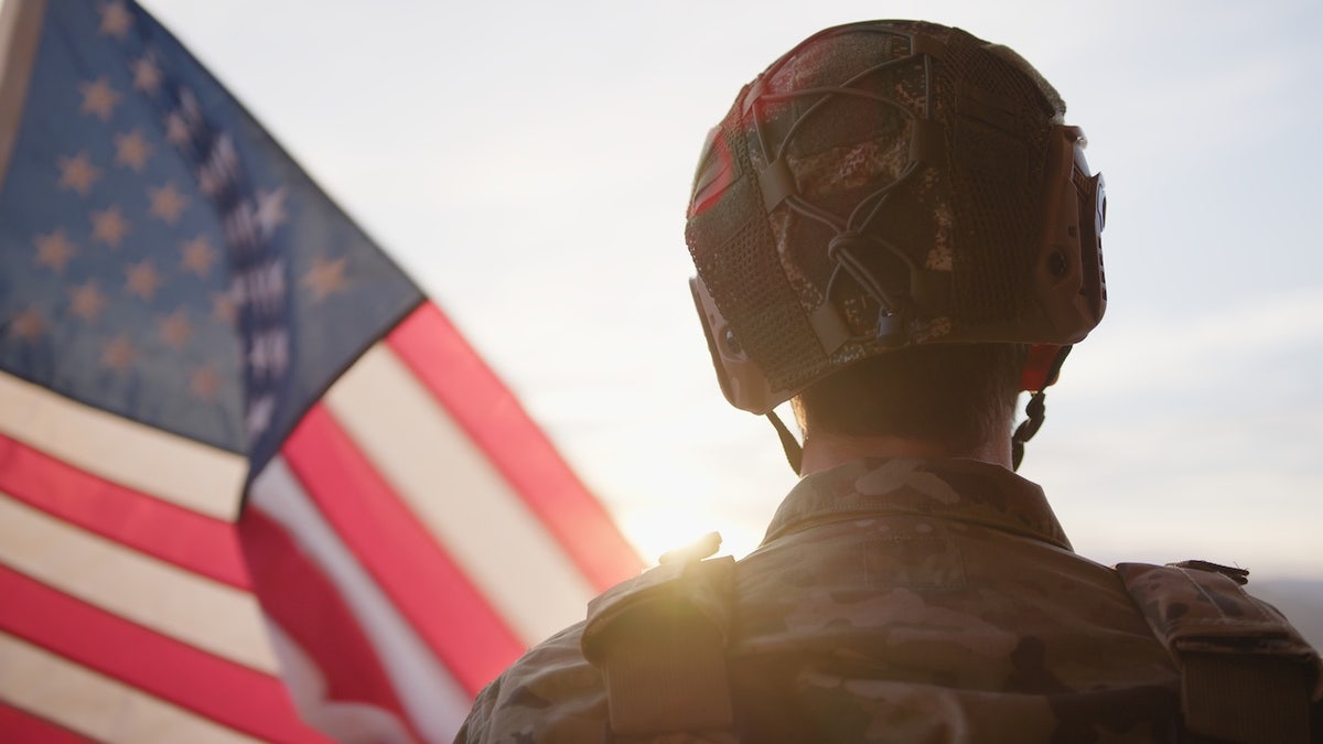 American Military Observes The US Flag During Veteran Day