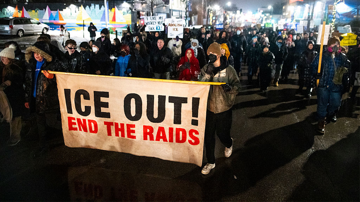 People march during a protest after the killing of Renee Nicole Good.