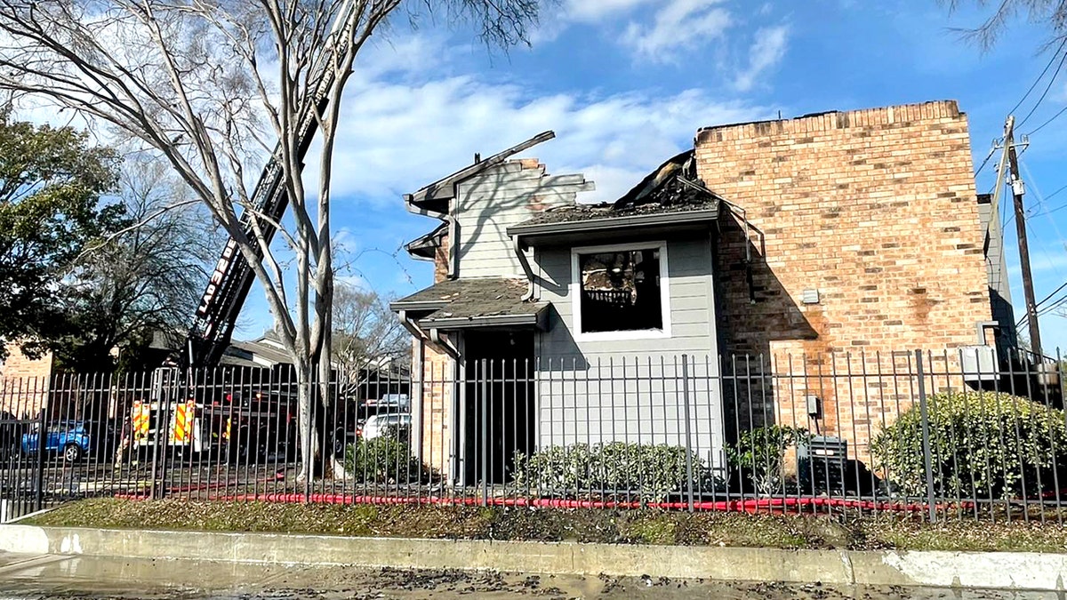 burned apartment unit with collapsed roof