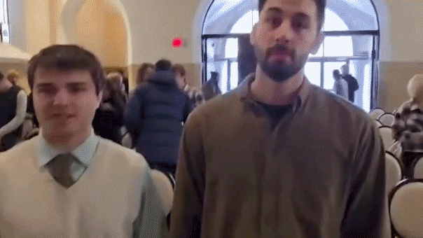 Gif of protester confronting church-goers.
