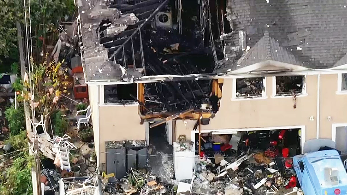 Wreckage and debris outside apartment building in California following explosion