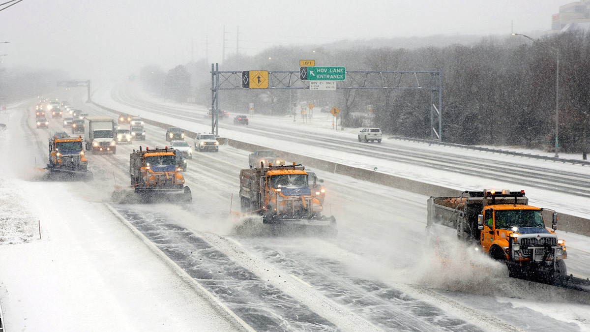 Snow plows on the Long Island Expressway