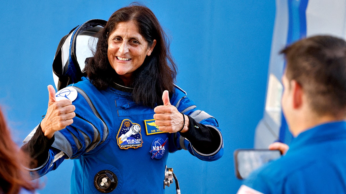 NASA astronaut Suni Williams gives thumbs up