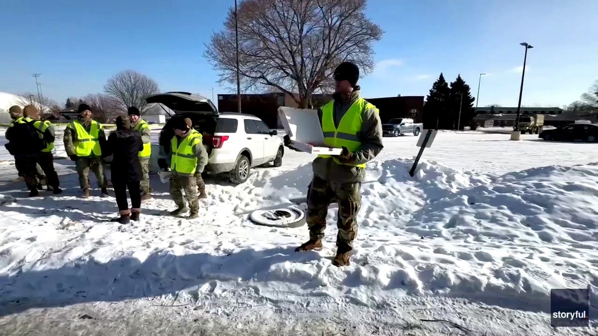 National Guard members handing out coffee and donuts