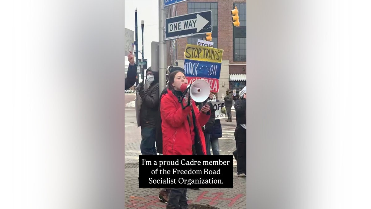 FRSO member Jessica Plichta protests in Grand Rapids