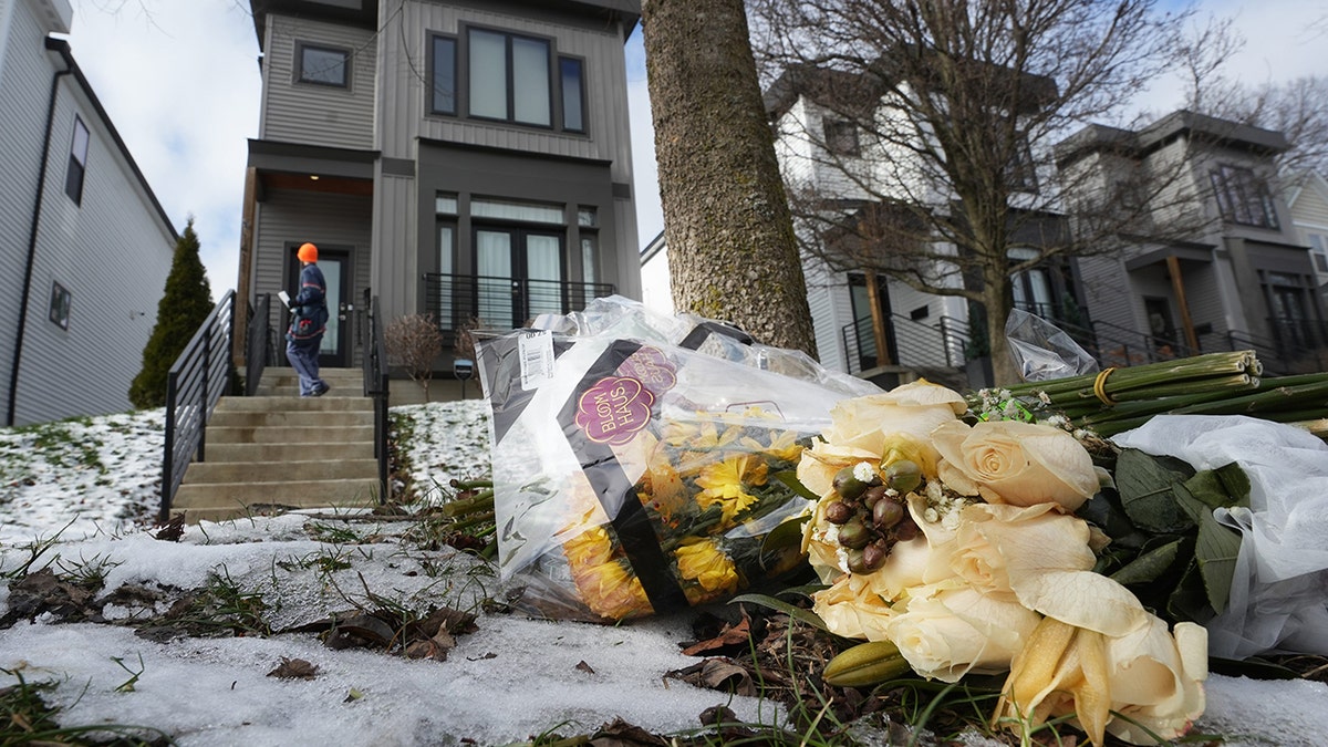 Flowers are left outside the home of Monique Tepe and Spencer Tepe