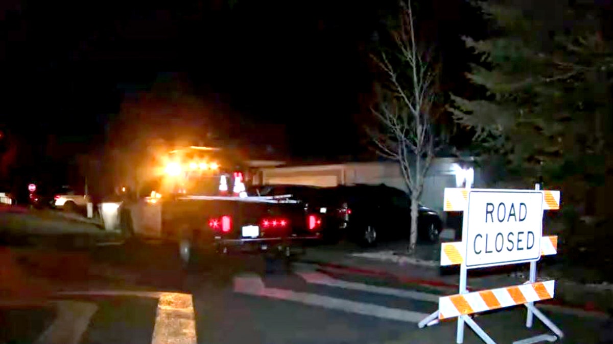 road closed sign and utility truck on road