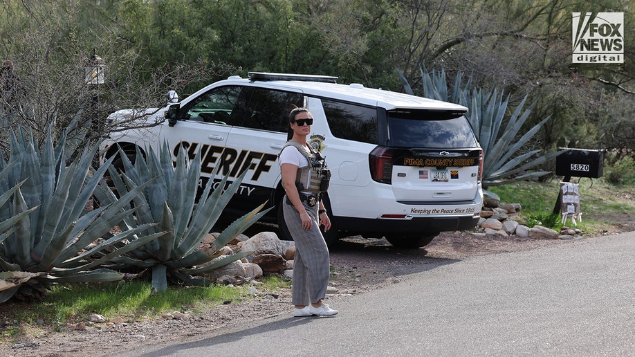 Pima County Sheriff's deputies assembling in front of Nancy Guthrie's home