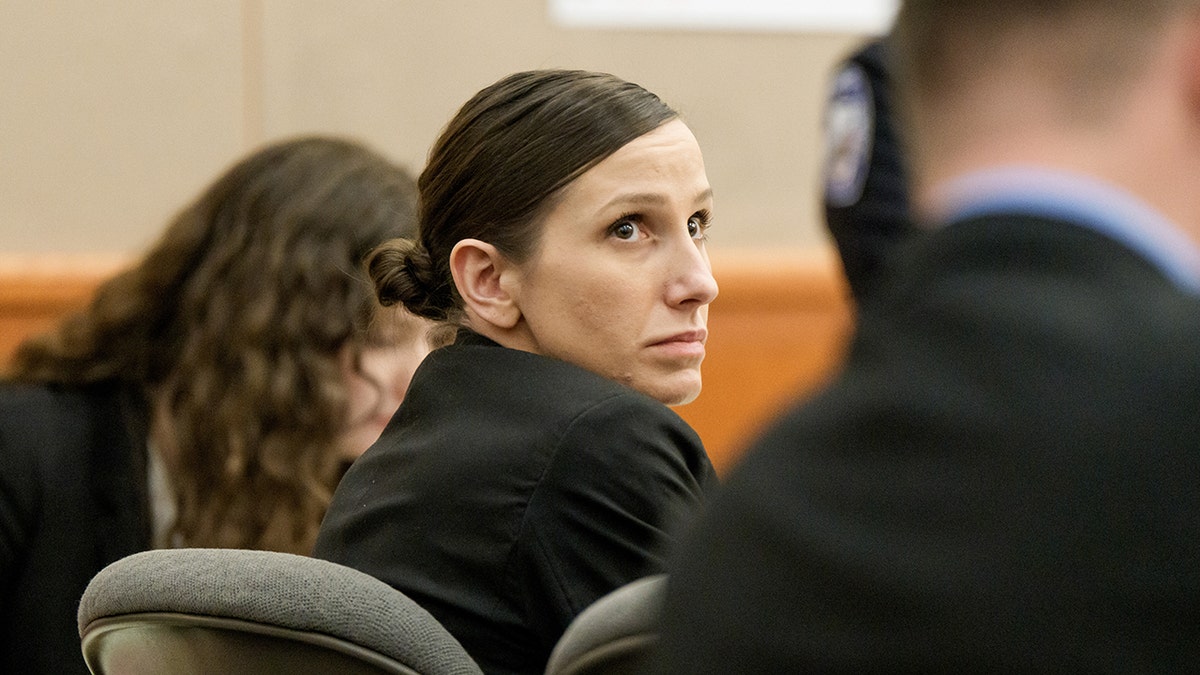 Kouri Richins looking forward while seated in a courtroom.