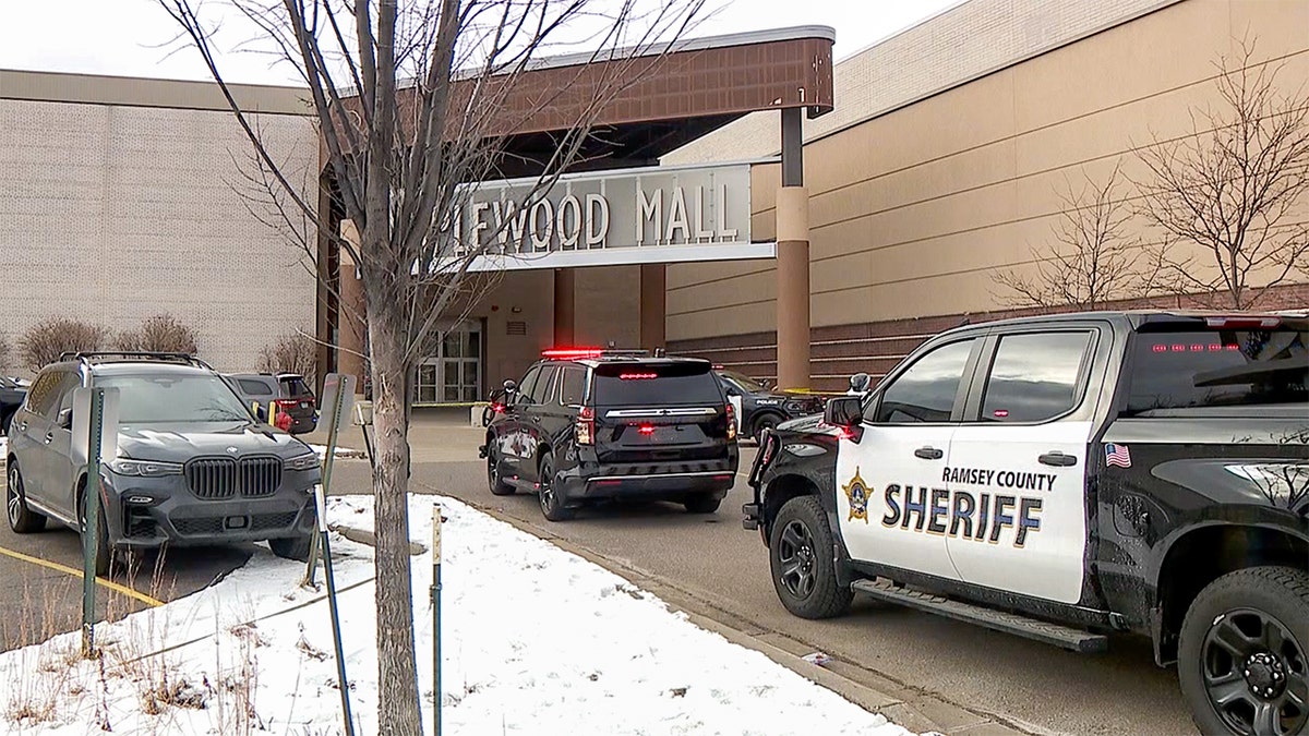 Authorities park outside of Maplewood Mall.