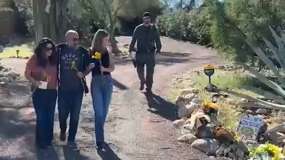 Guthrie sisters lay flowers
