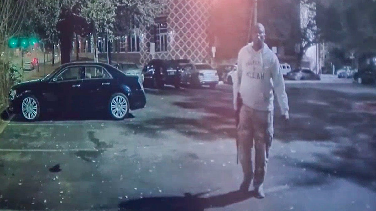 Shooter walking in the parking lot.