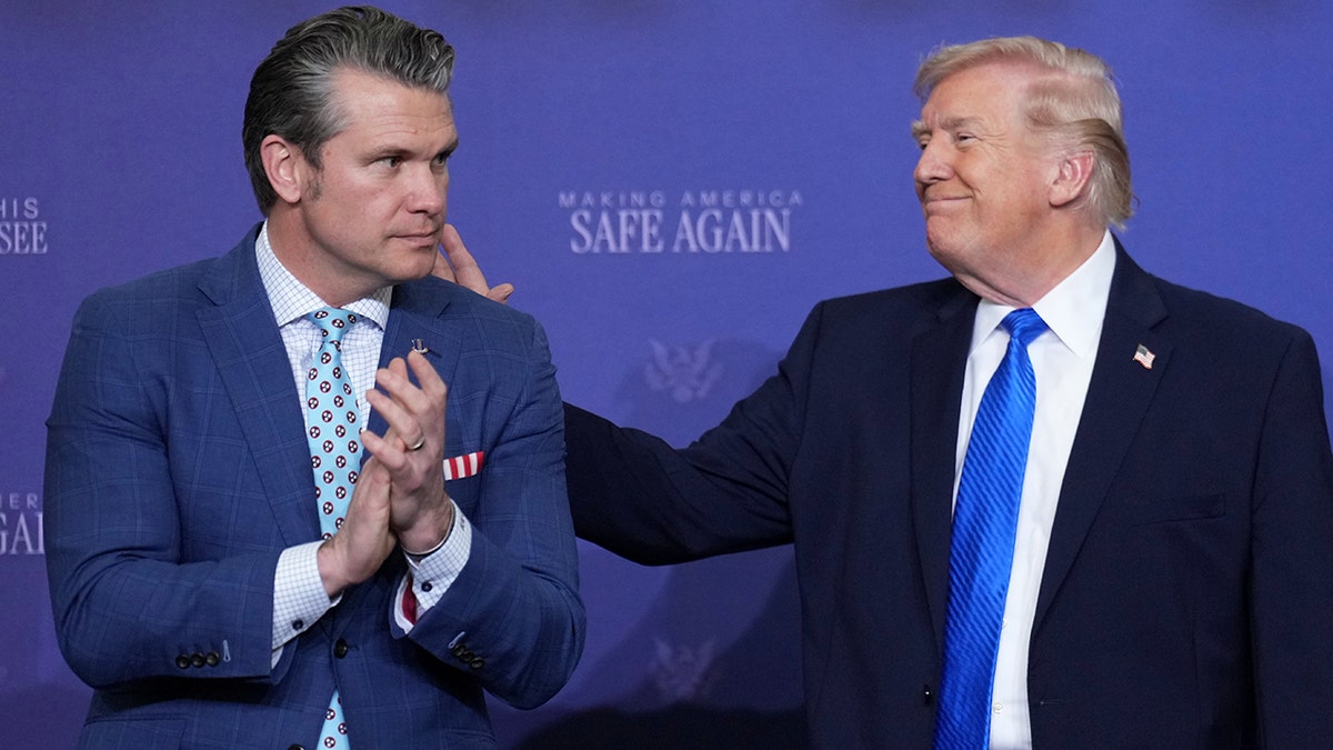 President Donald Trump speaking with Defense Secretary Pete Hegseth.
