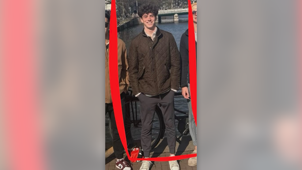 Jimmy Gracey pictured wearing a brown jacket, gray joggers and white sneakers