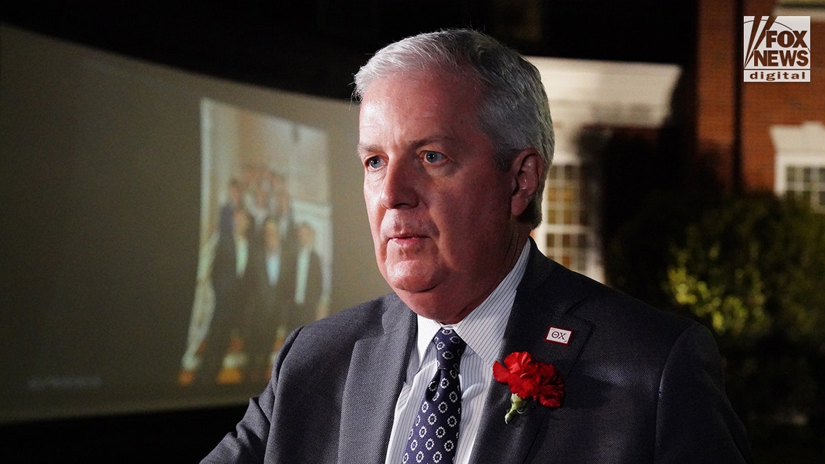 Mourners at a memorial vigil for Jimmy Gracey standing together