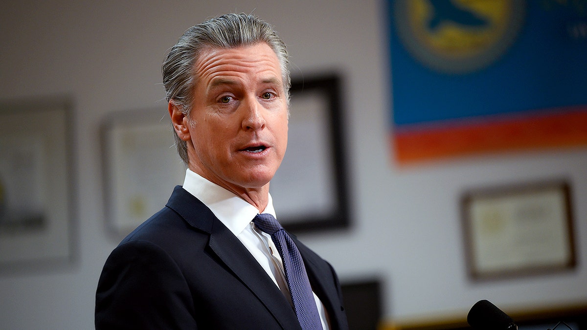 Gavin Newsom looks as he continues a potential campaign for president