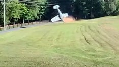 SEE IT: Small plane flips over in South Carolina backyard after pilot's deliberate maneuver