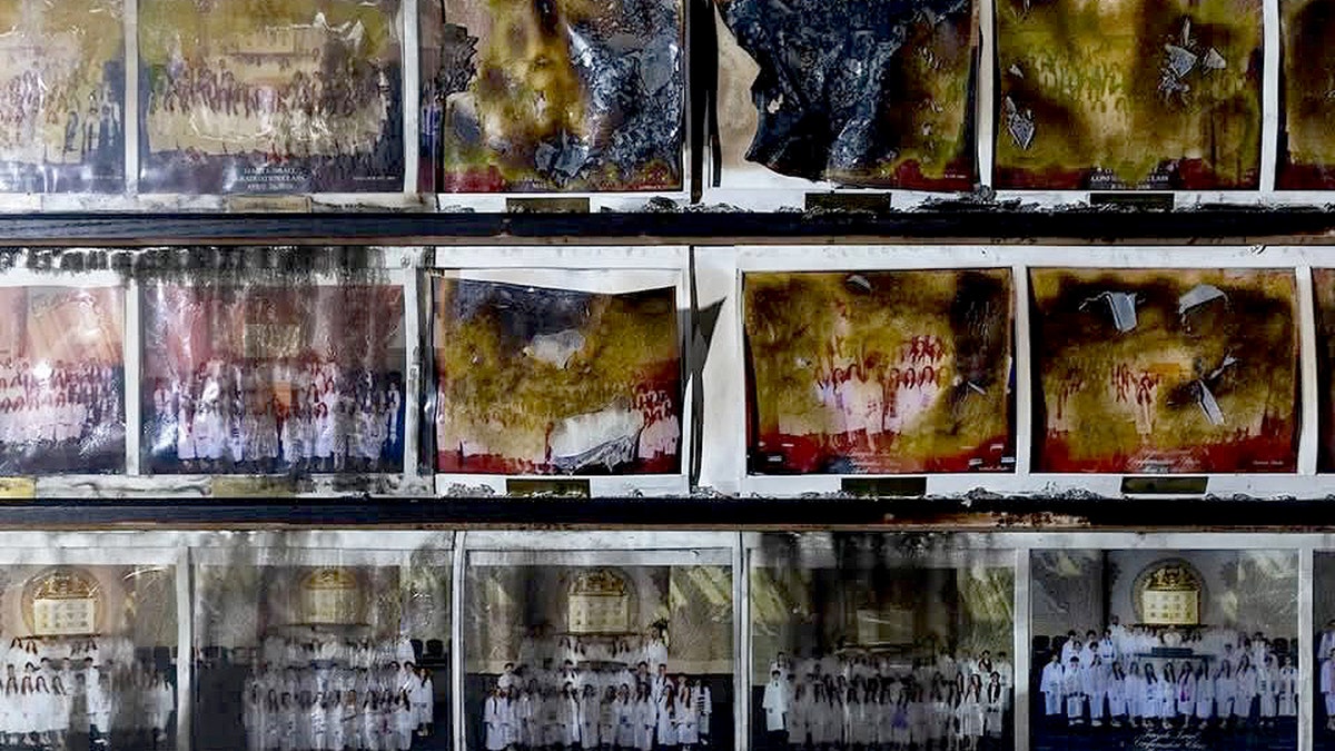 Damaged photos on the wall of Temple Israel