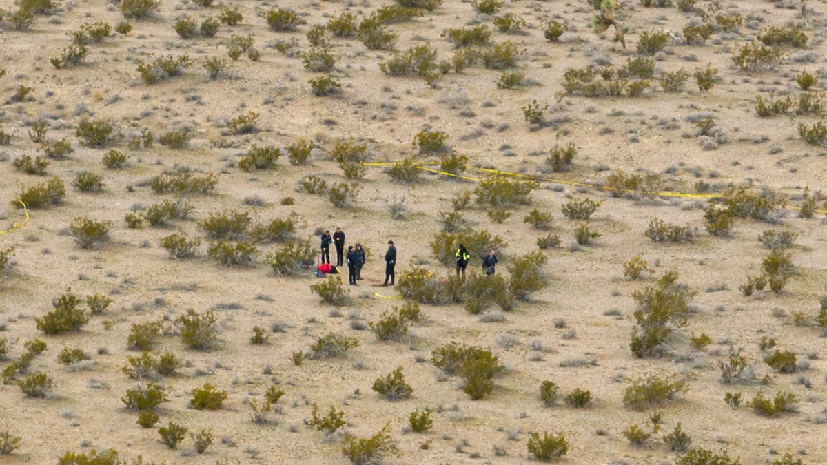 San Bernardino sheriff's department officials investigating a remote outdoor scene
