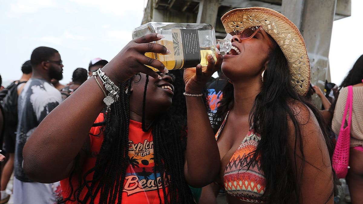 Two women party during Orange Crush