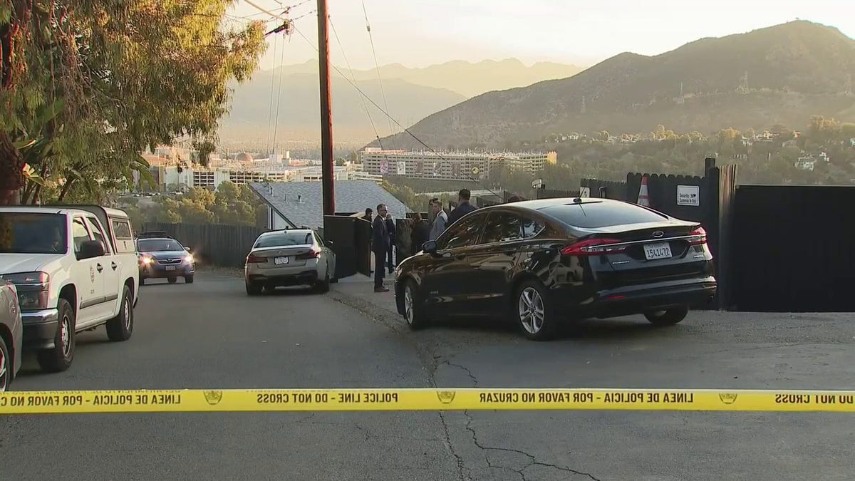 LAPD officers investigating armed robbery scene in Hollywood Hills home