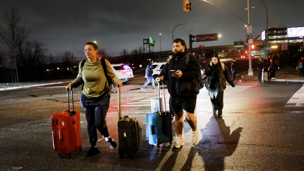 Travellers looking for rides outside LaGuardia Airport after plane and fire truck collision
