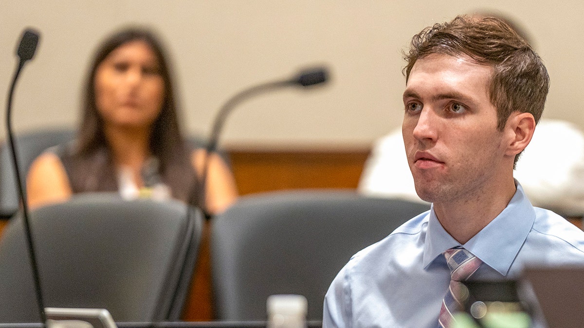 Tyler Robinson standing in a courtroom in Provo, Utah
