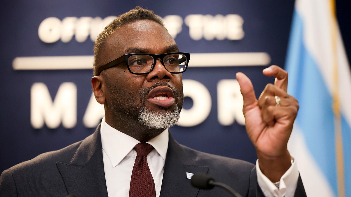 Chicago Mayor Brandon Johnson is shown from the neck up speaking at his office.