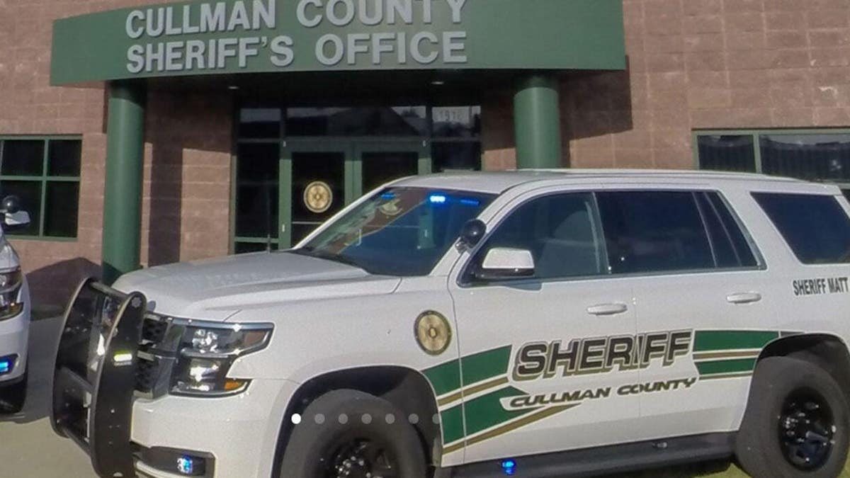 A parked Cullman County Sheriff's Office in front of a building.