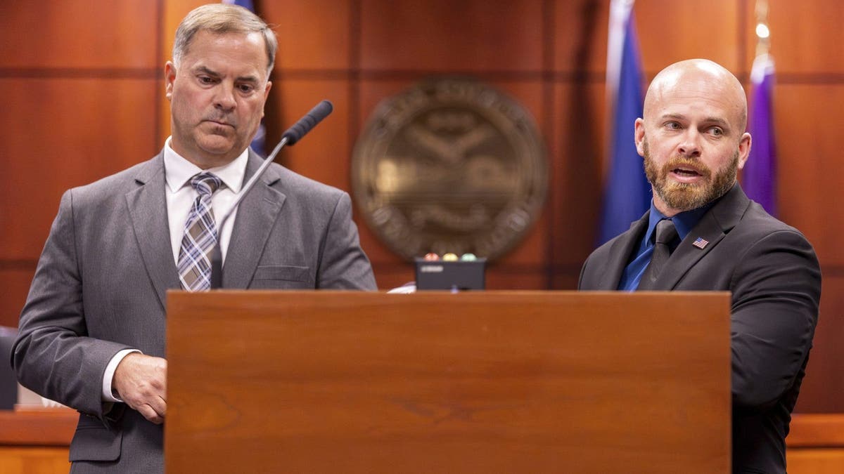 Cpl. Brett Payne and Lt. Darren Gilbertson speaking at a press conference