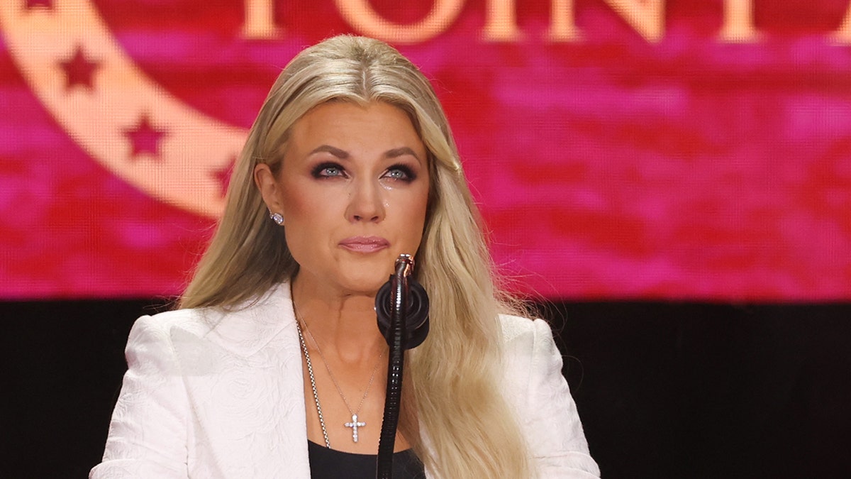 Erika Kirk speaking at a memorial service at State Farm Stadium in Glendale, Arizona