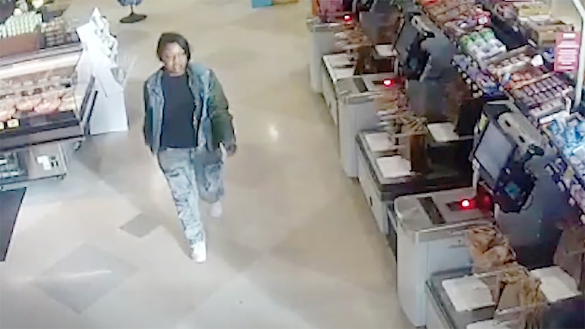 Woman walking in grocery store.