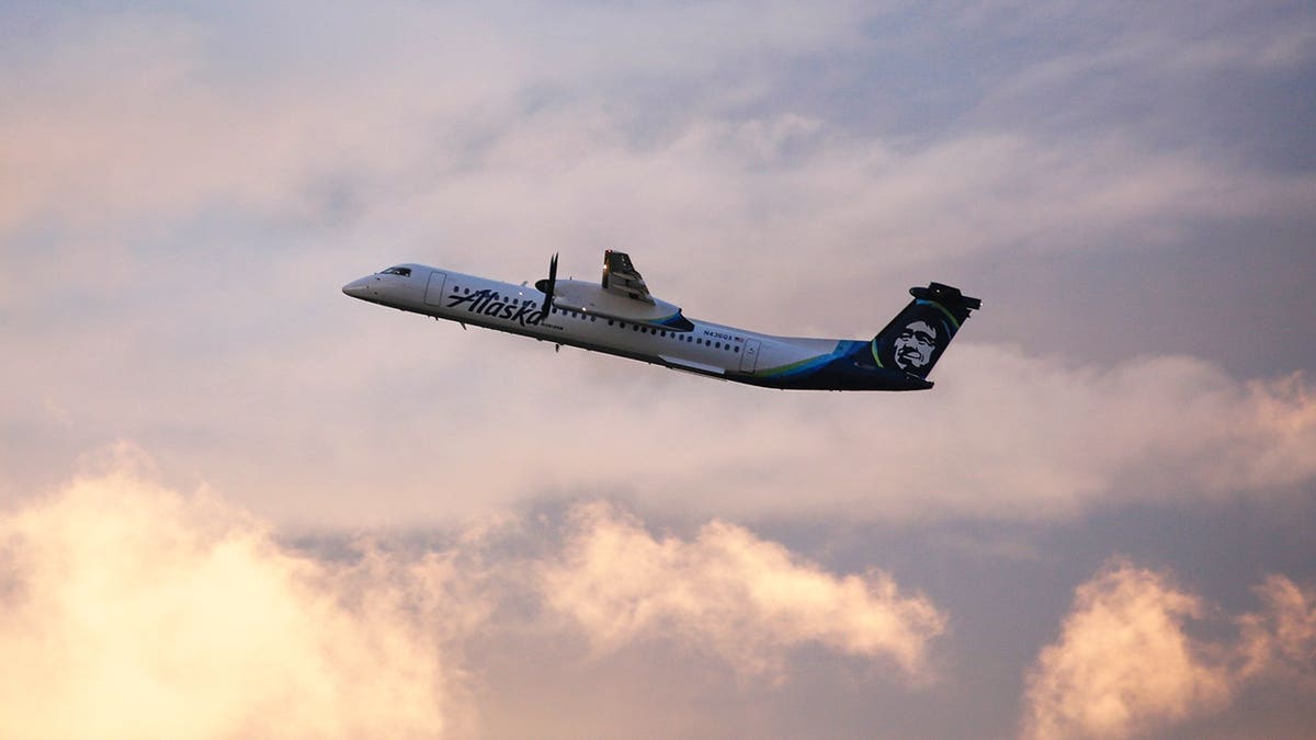 An Alaska Airlines Bombardier Dash 8 Q400 operated by Horizon Air taking off from Seattle-Tacoma International Airport.